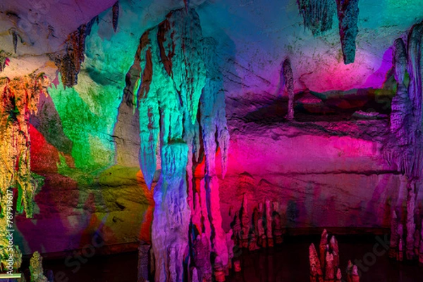 Fototapeta A natural cave in Guilin - China beautifully decorated with colorful lights