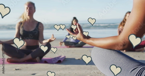 Obraz Image of yellow hearts over women practicing yoga on beach