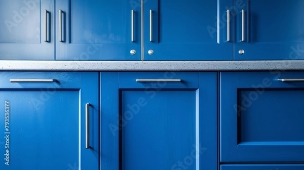 Fototapeta A market-style showcase of blue kitchen cabinet doors, adorned with contemporary stainless steel handles