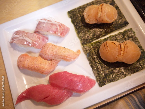 Fototapeta Assorted Aburi torch grilled sushi set with otoro fatty tuna, salmon and scallops served on nori seaweed on square plate close up, Tsukiji market, Tokyo