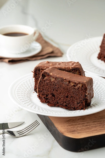 Fototapeta Fresh homemade chocolate sponge cake on wooden board