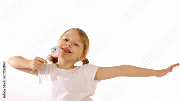 Fototapeta girl with lollipop on a white background