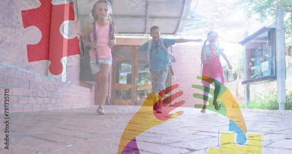 Fototapeta Image of puzzles falling over ribbon formed with puzzles and school children running in school