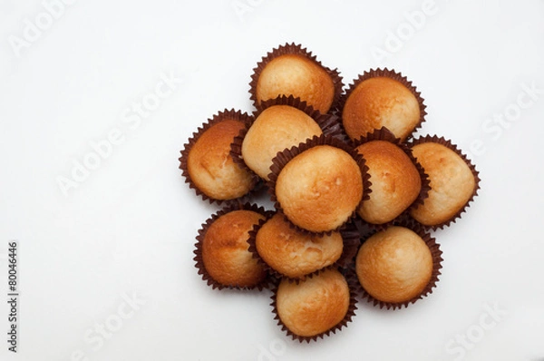 Fototapeta Cupcakes in decorative arrangement on white background