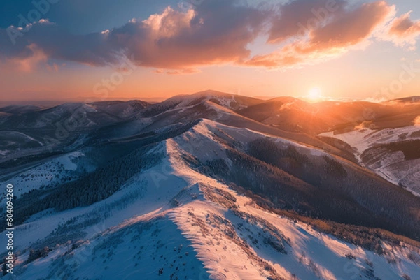 Fototapeta Aerial view of mountain ridge, winter during sunset 