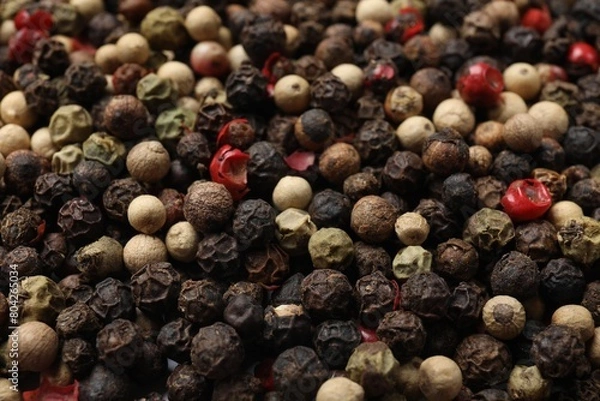 Fototapeta Aromatic spices. Different peppers as background, closeup