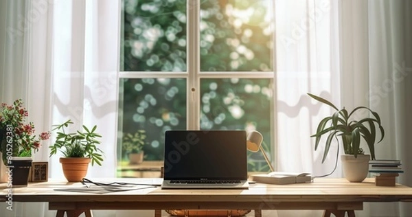 Fototapeta A Serene Home Office Space with a Laptop on a Table Near a Window