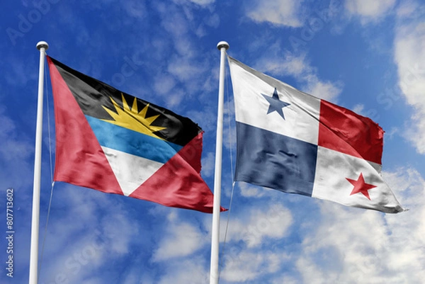 Fototapeta 3d illustration. Antigua and Barbuda and Panama Flag waving in sky. High detailed waving flag. 3D render. Waving in sky. Flags fluttered in the cloudy sky.