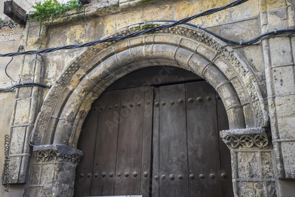 Fototapeta medieval door Spanish city of Segovia. Old wooden entrance. anci