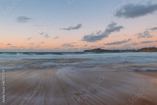 Fototapeta Beautiful morning on an empty beach coastline.