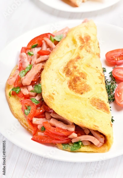 Fototapeta Omelette with vegetables and ham