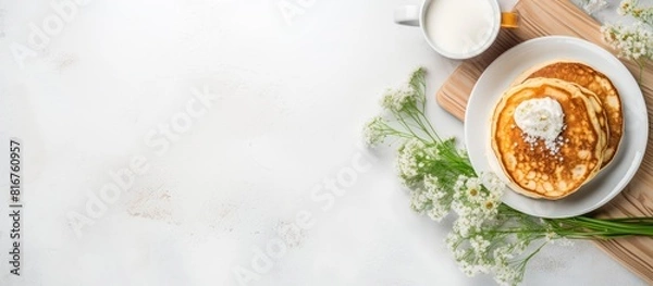 Fototapeta Summer Breakfast with cottage cheese pancakes cup of black coffee milk on white table background Top view copy space