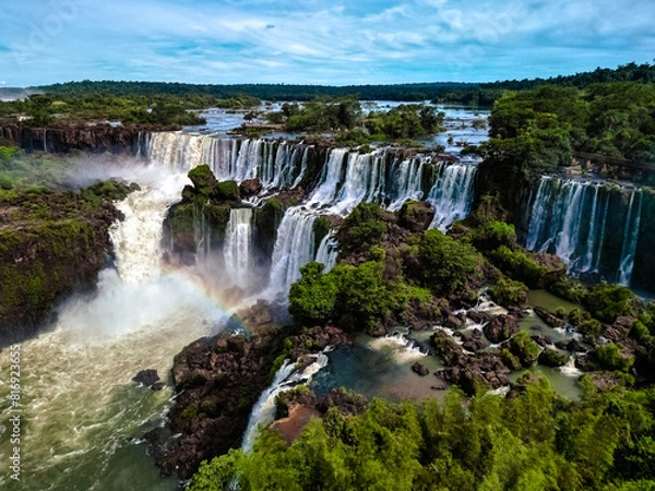 Fototapeta Top down aerial view of the picturesque Iguazu (Iguacu) Falls on the border of Brazil and Argentina in a national park surrounded by tropical forest and trees. Drone shooting