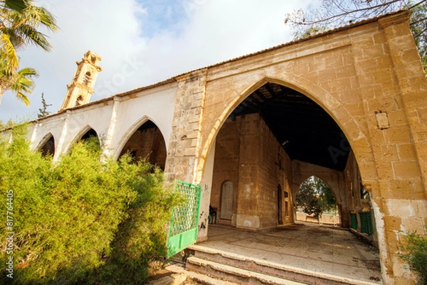 Fototapeta old stone arch and tower