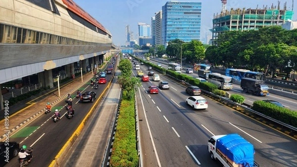 Fototapeta a busy highway with many cars and buses