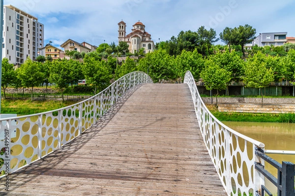 Fototapeta A view over a pedestrian bridge on the River Drin at Lezhe, Albania in summertime