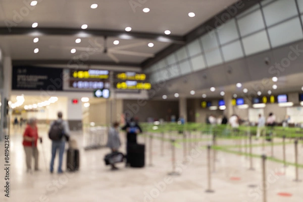 Fototapeta Abstract blur and defocused airport terminal. People in airport. Traveling concept.