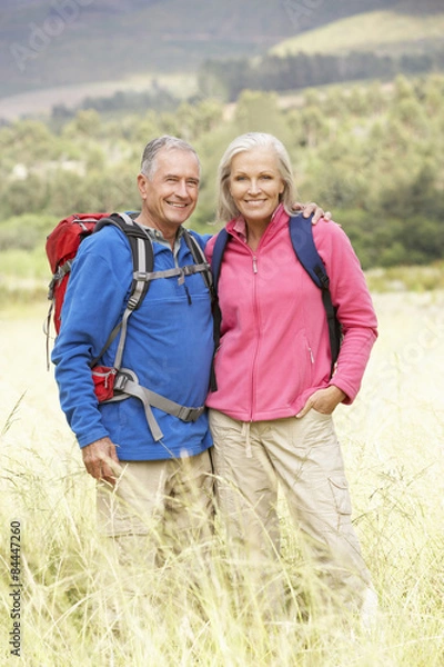 Fototapeta Senior Couple On Hike Through Beautiful Countryside