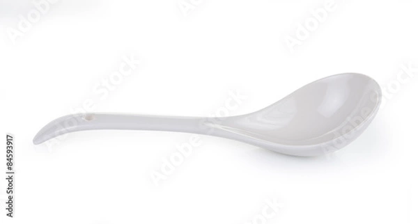 Fototapeta White empty ceramic spoon on white background