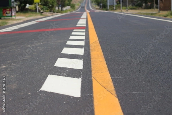 Fototapeta road with yellow line with crosswalk