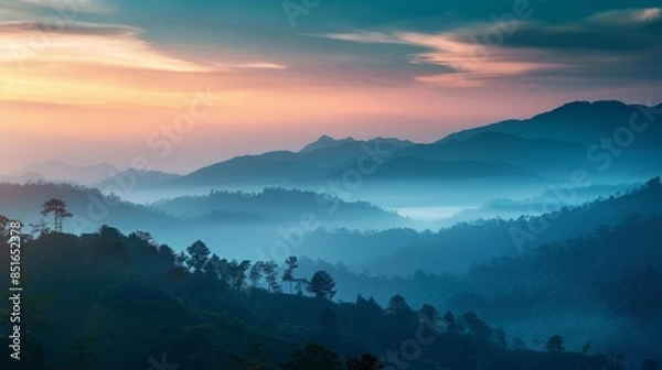 Fototapeta A Serene Panorama of Misty Mountains Bathed in the Golden Hues of Sunrise