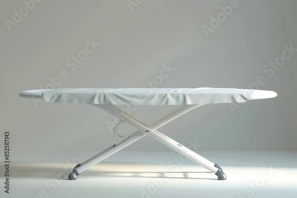 Fototapeta A close-up shot of a white ironing board placed on top of a table