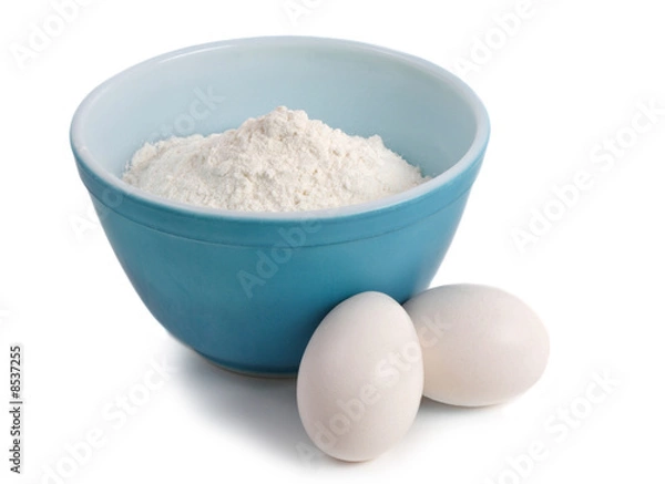 Fototapeta bowl filled with flour and eggs