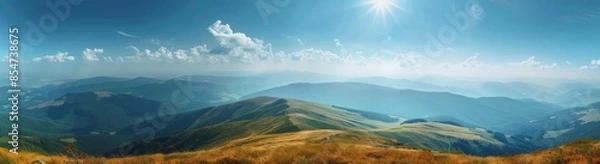 Fototapeta Mountain Range Panorama With Golden Grass and Blue Sky