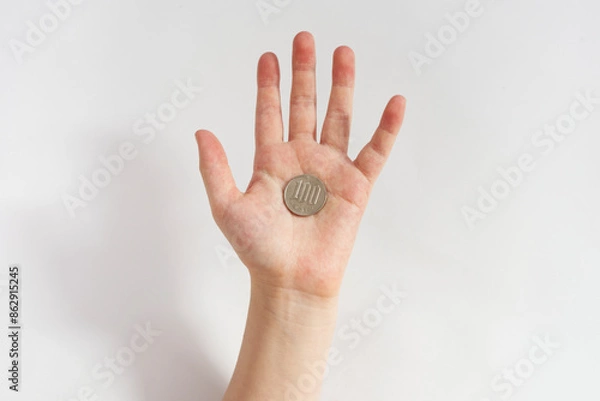 Fototapeta Hand of a child receiving allowance