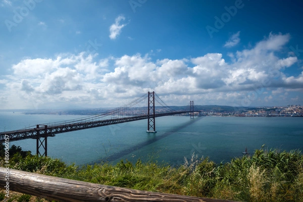 Fototapeta Scenic Vista of 25 de Abril Bridge spanning the Tagus River - Lisbon, Portugal