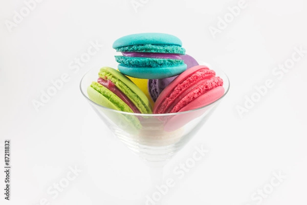 Fototapeta Colorful macaron in glass on white background.