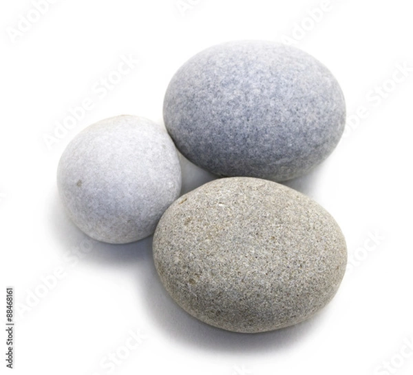 Fototapeta Beautiful stones isolated on white background with shadow. Closeup grouped round stones. Studio photographed stones.