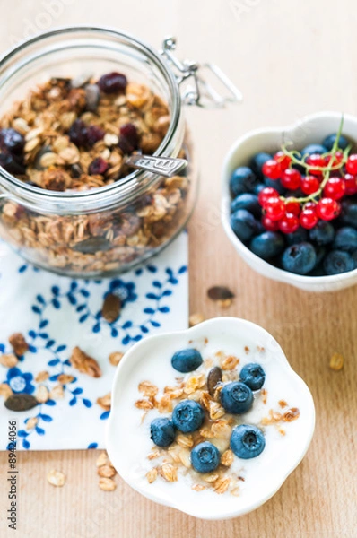 Fototapeta Healthy breakfast with granola, yogurt and fresh fruits