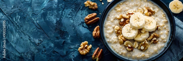 Fototapeta Bowl of Oatmeal with Bananas and Walnuts