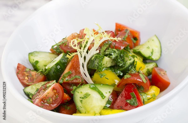 Fototapeta vegetable salad cucumber tomato pepper with sunflower oil