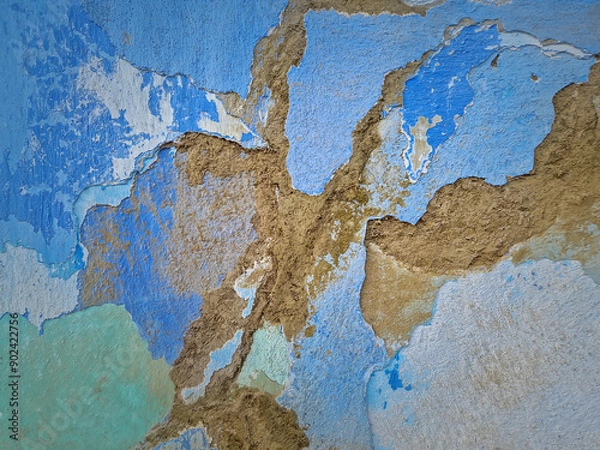 Fototapeta Old peeling wall with different layers of construction materials. Weathered lime facade with clay and dung plaster. Abstract texture of a building element surface