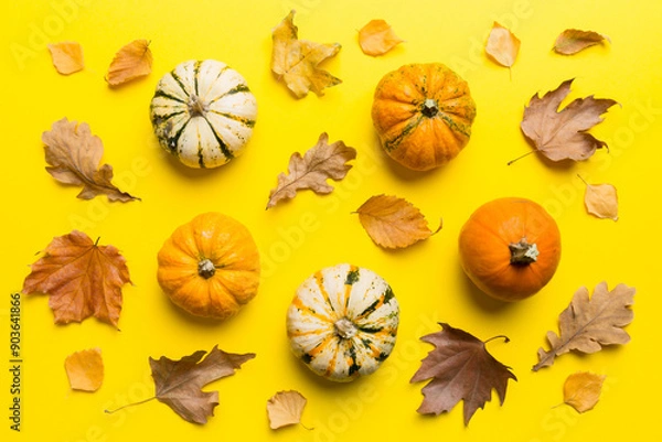 Fototapeta Autumn composition. Pattern made of dried leaves and other design accessories on table. Flat lay, top view