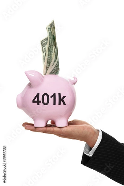 Fototapeta Businessman hand holding a piggy bank for 401k savings and money