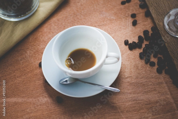 Fototapeta Empty white cup of hot coffee latte on wooden table