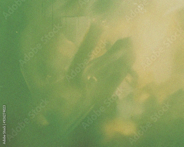 Fototapeta Abstract green blurred grainy gradient background with a grungy texture