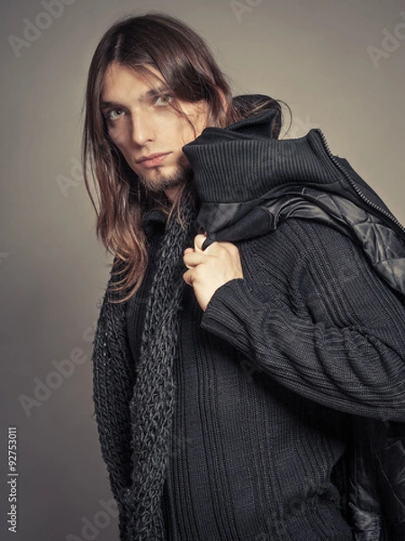 Fototapeta Handsome fashion man portrait wearing black coat.