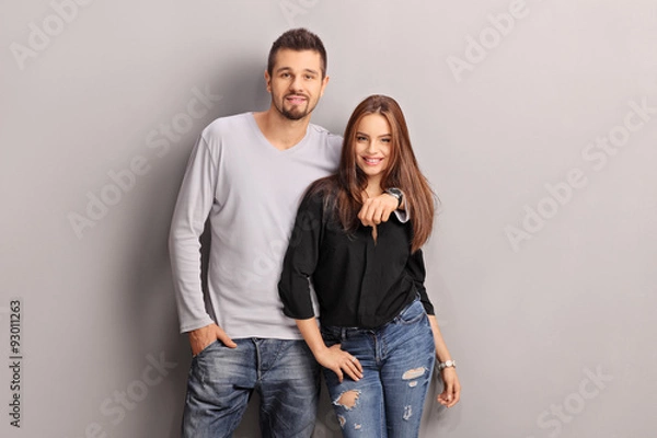 Fototapeta Young man hugging his girlfriend