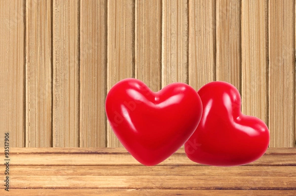 Obraz Two red hearts on the wooden background