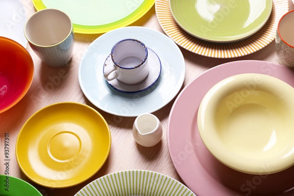 Fototapeta Set of colourful plates on the table