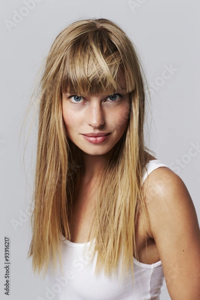 Fototapeta Good looking young woman looking at camera