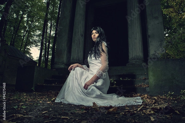 Fototapeta Witch from a crypt in the cemetery