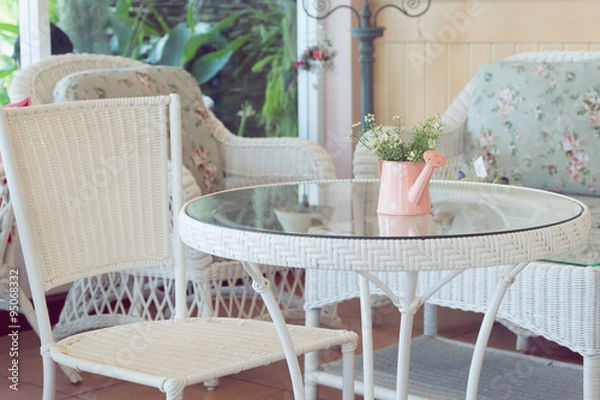 Fototapeta design of vintage style interior in cafe with flowers vase