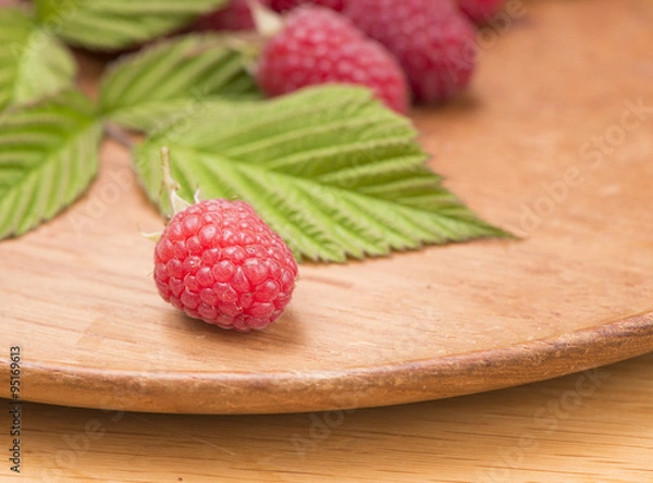 Fototapeta Fresh ripe raspberries in close up