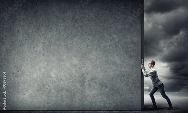 Fototapeta Guy pushing cement banner