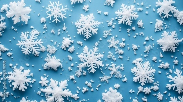 Fototapeta detailed snowflakes in close-up on a lovely blue background,